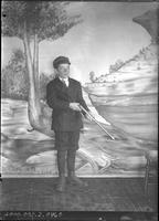 [Single portrait of a young Boy with rifle]