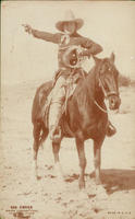 George O'Brien ranger lassoing steer