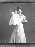 [Carte de Visite single portrait of an adult Female holding Infant Child]