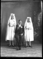 Catholic Communicants. [Single portrait of two young Females and one young Male]