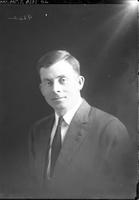 Single portrait of an adult Man, Dover Trent, sitting