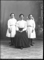 [Single portrait of a person and two children]