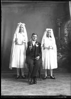 Catholic Communicants. [Single portrait of two young Females and one young Male]