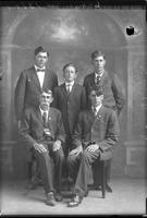 Single group portrait of a Joe Wehr sitting and his four young sons, one sitting
