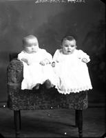 [Carte de Visite single portrait of two Infants sitting in chair]