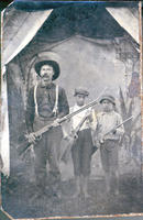 [Hunter and two sons with rifles]