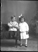 [Single portrait of a young Girl and an Infant]