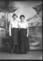 [Single portrait of two young Females standing]