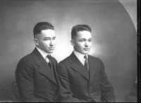 [Single portrait of two young Men sitting]