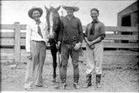 [Three men posed possibly Tom Mix in center]