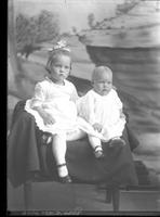 [Single portrait of a young Girl and an Infant]