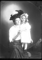 [Single portrait of a person and a child]