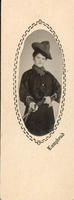 [woman in western dress holding rifle]