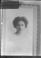 [Photograph of a photograph of a single portrait of an adult Female]