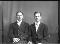 [Single portrait of two young Man sitting]