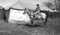 Col. Jim Eskew mounted on horse at the J.E. Ranch Rodeo.