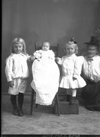 [Single portrait of two young Girls, an Infant, and one adult Female]