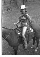 [Mary Louise Eskew, sitting atop horse, poses for November 1969 Western Outfitter article]