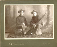 [Two soldiers with rifle]