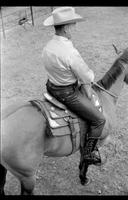[Junior Eskew, sitting atop horse, poses for November 1969 Western Outfitter article]