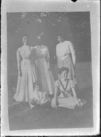 [Photograph of a photograph of a single portrait of four people and a child]