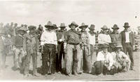 [Group portrait of cowboys perhaps participating in rodeo]