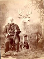 [Hunter holding Winchester, model 1886]