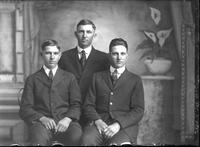 [Single portrait of three young Men two sitting]