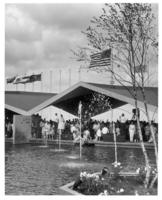 [Fountains, water, Spectators, & several Flags]