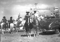 [Possibly Gene Autry and unidentified cowboy posed on horses]