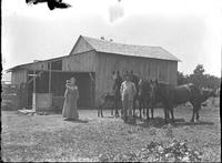 [Single portrait of people in their farm yard]