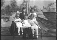 [Single portrait of three young Girls, one young Boy, and an Infant]