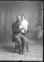 [Single portrait of a person and child]