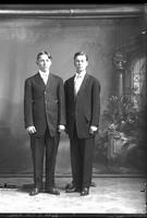 [Single portrait of two young Men standing]