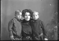 [Single portrait of an adult and two young children]