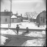Two young Boys playing in snow