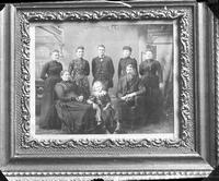 [Photograph of a framed family portrait]