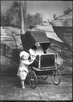[Infant with carriage]