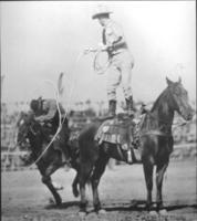 [Chet Byers roping a rider]
