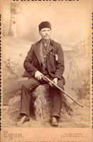 [South Dakota hunter with rifle]