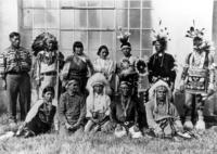 Twelve Native Americans in traditional dress at Santa Fe Indian School
