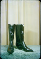 [Black boots with initials "R.A."]