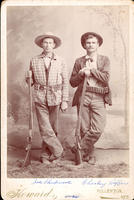[Two cowboys with rifles]