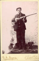 [Hunter with rifle and dog]