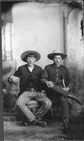 [Portrait of two young cowboys]
