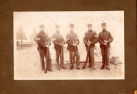 [Five soldiers with rifles in camp scene]