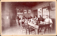 [Quanah Parker and his wife entertain in their dining room]