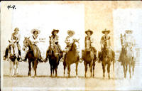 [Seven rodeo cowgirls on horseback]