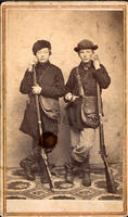 [Two young hunters with rifles and game bags]