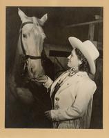 [portrait photograph of Tad Lucas and a horse]